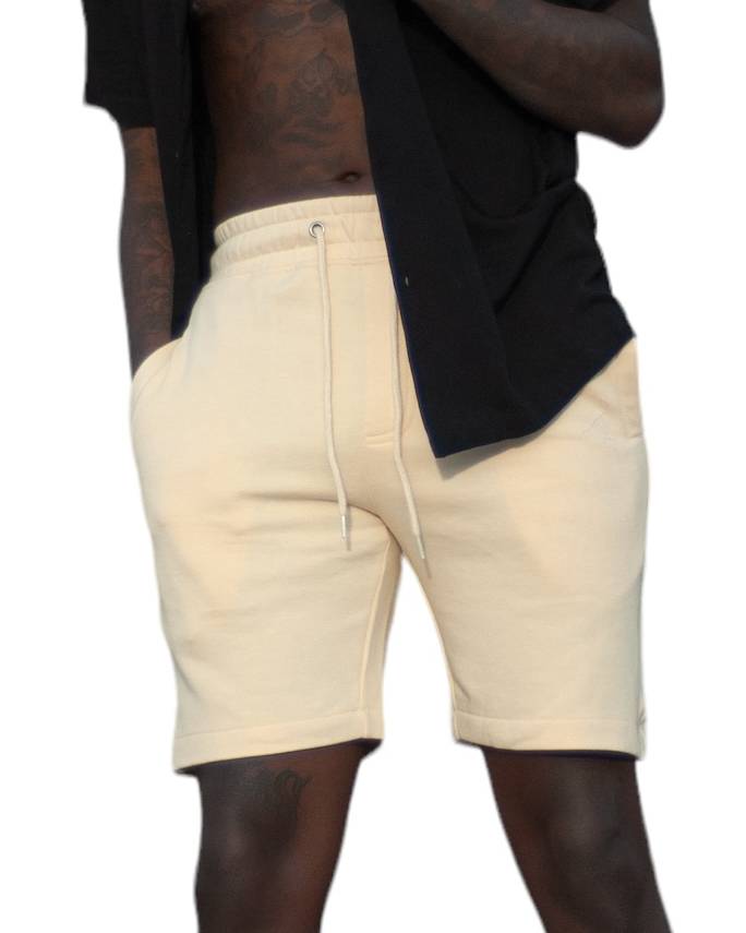 Bone-colored nylon active shorts by Royal Blue® Apparel, featuring deep front pockets and dual rear pockets